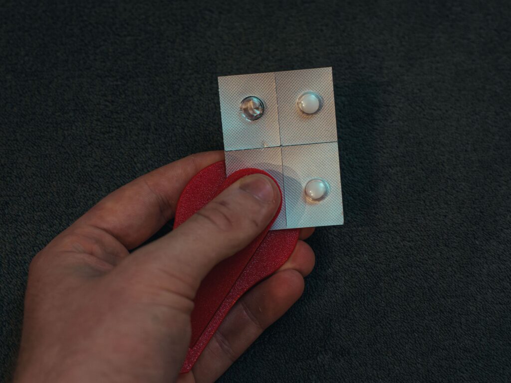 Top-view of EasyPill being used to take out a small pill